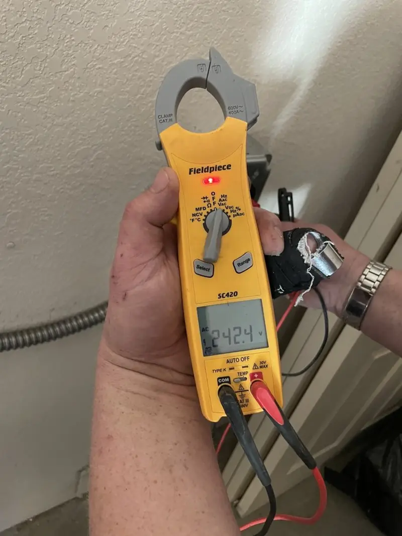 Voltage testing with clamp meter during Aluminum Wiring Replacement in Waukee